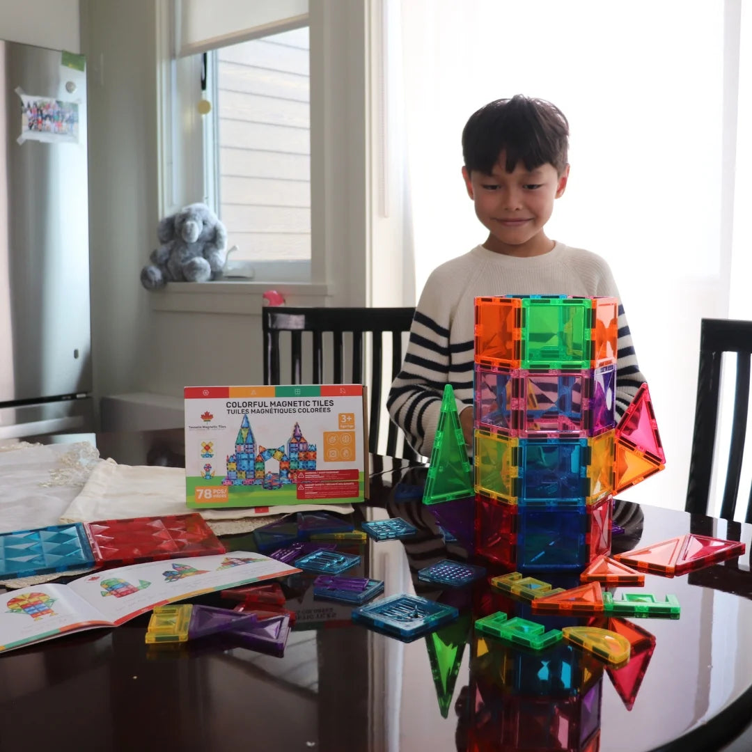 Child building with Tessella Explorer Set – 78 Piece Magnetic Tiles on a table, STEM educational toy for kids ages 3+, compatible with Connetix, PicassoTiles, Magna-Tiles.