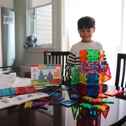 Child building with Tessella Explorer Set – 78 Piece Magnetic Tiles on a table, STEM educational toy for kids ages 3+, compatible with Connetix, PicassoTiles, Magna-Tiles.