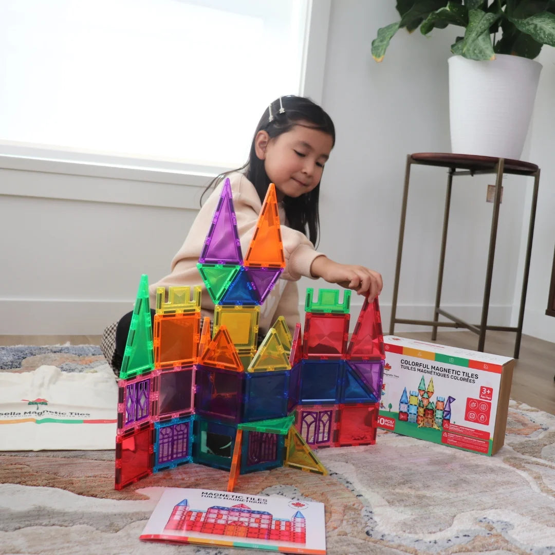 Child building a colorful castle with Tessella Spark Set – 50 Piece Magnetic Tiles, STEM educational toy for kids ages 3+, compatible with Connetix, PicassoTiles, Magna-Tiles.