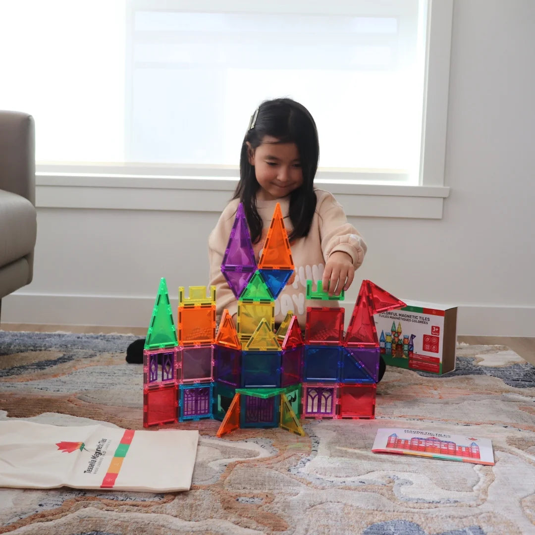 Child playing with Tessella Spark Set – 50 Piece Magnetic Tiles, colorful STEM building toy for kids ages 3+, compatible with Connetix, PicassoTiles, Magna-Tiles